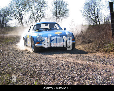 French blue rally Alpine Renault A110 at speed on gravel road International Horneland Rally Netherlands Stock Photo