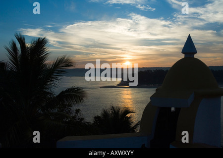 Sunset over the Tiracol River  viewed from Fort Tiiracol, Goa, India Stock Photo