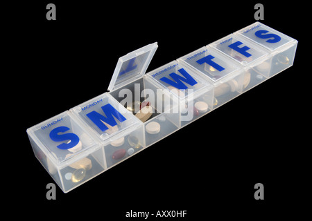 Open pill dispenser close up Stock Photo