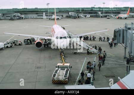 Passengers boarding an EasyJet Boeing 737 aeroplane at Stansted Airport, England.