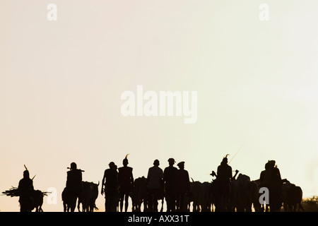 Hamer (Hamar) people walking back from bull jumping ceremony,Turmi, Lower Omo Valley, Ethiopia, Africa Stock Photo