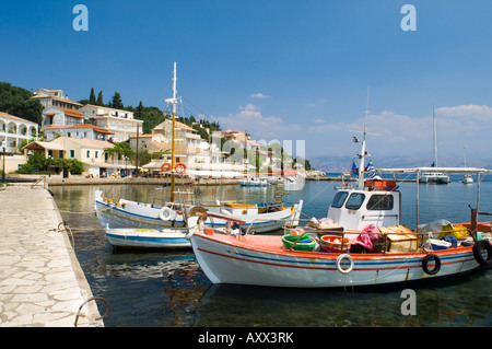 Fishing boats in the harbour in Kassiopi on the northeast coast of Corfu, Ionian Islands, Greek Islands, Greece, Europe Stock Photo
