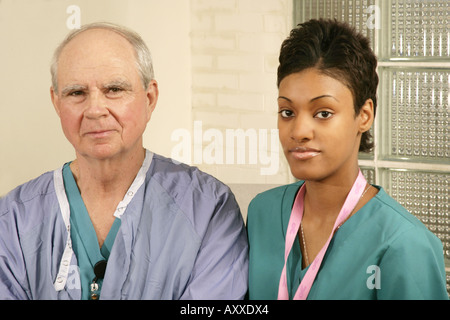 Surgical staff includes doctor (surgeon) and head nurse. Stock Photo