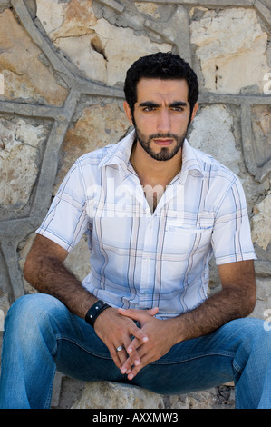 young man sitting down Stock Photo