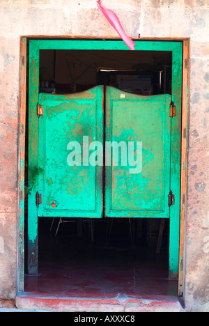 Weathered green saloon doors San Miguel de Allende Mexico Stock Photo