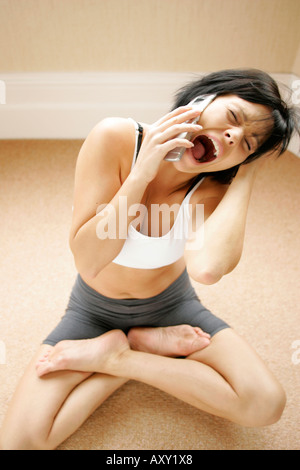 Frustrated girl with phone Stock Photo