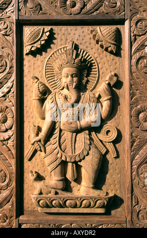 Nepal Patan crafts carved decoration on door panel Ganesh Hindu elephant god Stock Photo