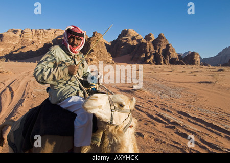 Bedouin on camel in the desert, Wadi Rum, Jordan, Middle East Stock Photo