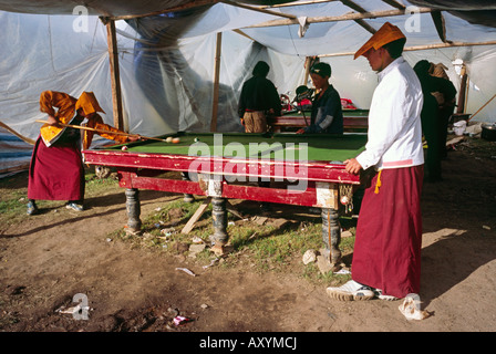 Aug 4, 2006 - Young Tibetan monks enjoy a game of Pool during the Litang horse festival in the Tibetan town of Litang in China. Stock Photo