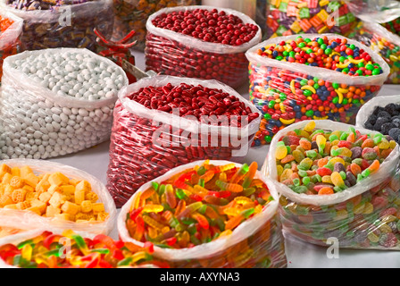 Colorful composition of bulk candy in bags in open air market Stock Photo