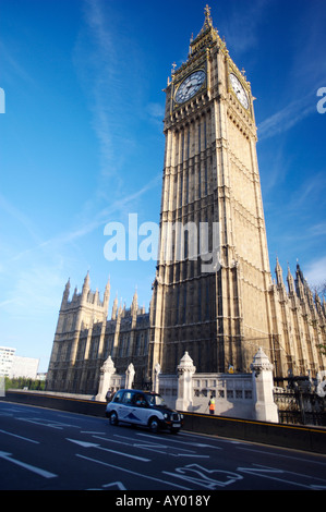 Big Ben clock tower with taxi passing by Stock Photo