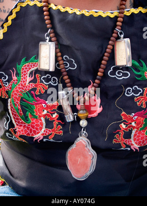 lucky amulets worn at the Wat Bang Phra Tattoo Festival in Thailand Stock Photo