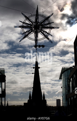 A Christmas decoration suspended above the Birmingham City Centre church of St Martins in the Bull RIng England UK Stock Photo