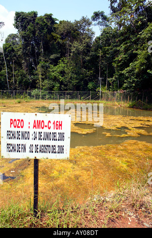 Bioremediation pond for soil contaminated by crude oil beside an oil well in the Amazon Stock Photo