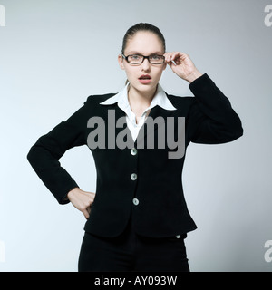 studio shot portrait of a beautiful young angry woman in a costume suit Stock Photo