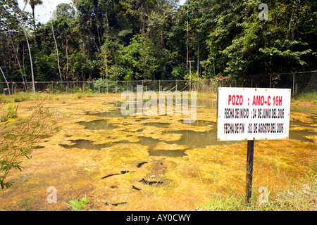 Bioremediation pond for soil contaminated by crude oil beside an oil well in the Amazon Stock Photo