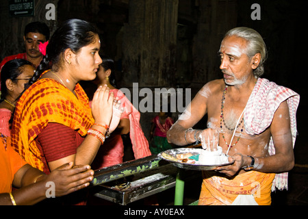 Brahmin blessing worshiper, Meenakshi Temple, Madurai, Tamil Nadu, India Stock Photo