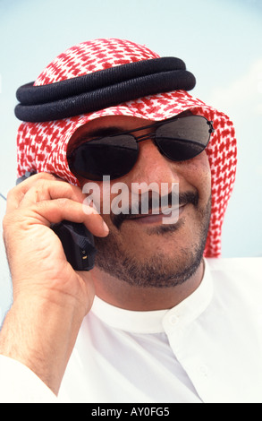 saudi arabian businessman talking on a mobile phone in dubai the united arab emirates Stock Photo