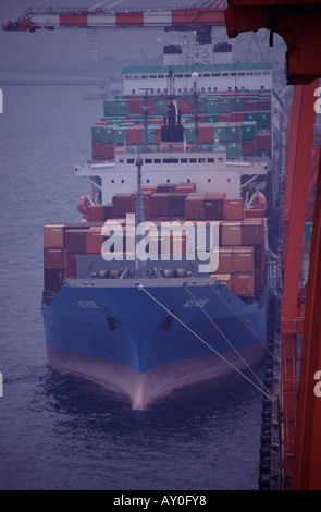 Containership at berth quayside in yokohama harbour port tokyo bay japan head on shot from high infront Stock Photo