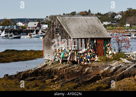 Lobster Bouys Outside of Fishing Shack at Low Tide on Mackerel Cove Bailey Island Maine Stock Photo