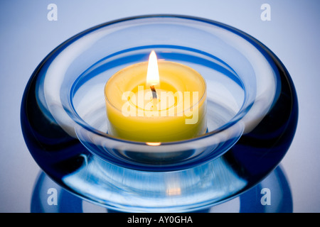 Candle in ashtray Stock Photo
