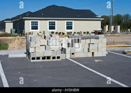 Cinder Blocks Stacked in Front of a House under Construction Stock Photo
