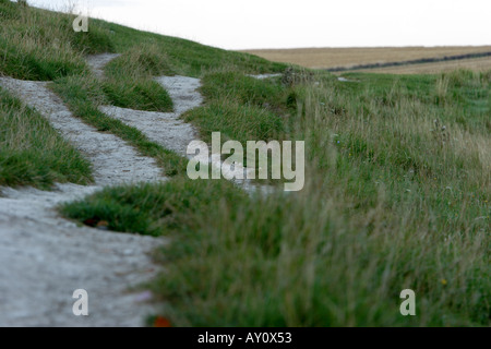Eroded footpath on embankment of Avebury stone circle in Wiltshire Stock Photo