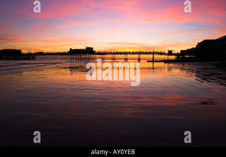 A colourful sunset behind Worthing Pier, West Sussex on the southcoast of England, UK on a cold November evening. 2005 Stock Photo