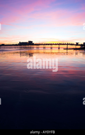 A colourful sunset behind Worthing Pier, West Sussex on the southcoast of England, UK on a cold November evening. 2005 Stock Photo