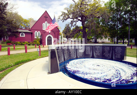 Hurricane Camille memorial with the Church of the Redeemer and American flag in Biloxi Mississippi USA Stock Photo