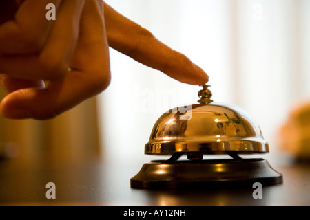 Man ringing service bell Stock Photo