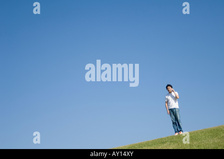 Mid adult man talking with cell phone Stock Photo