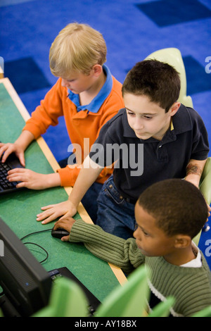 Elevated view of schoolboys using computer in the library Stock Photo ...