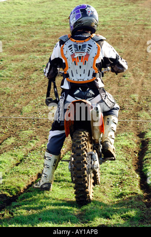 a guy rider on a motocross bile motorcycle jumping and racing big air Stock Photo