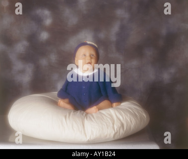 Child on Cushion Stock Photo