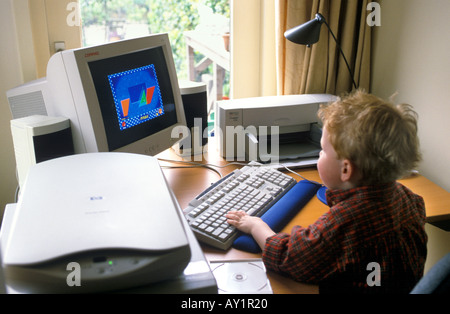 Backview of a boy behind his computer in his room Stock Photo - Alamy