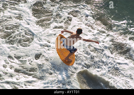 Young boy skim boarding Stock Photo