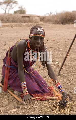 Tribal warrior kneeling Stock Photo - Alamy
