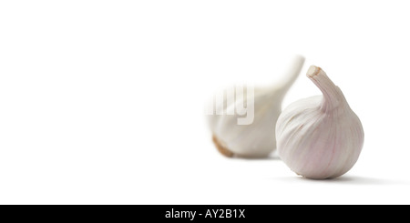 Two bulbs of garlic on white Stock Photo