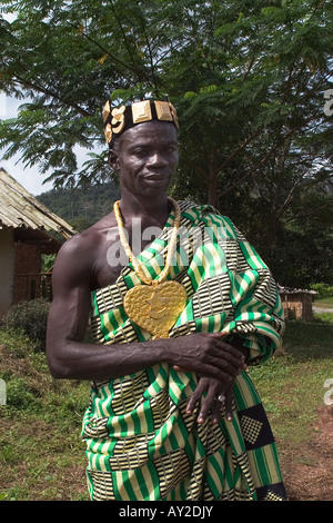 African chief in his village dressed in ceremonial regalia and Kente cloth, Western Ghana Stock Photo