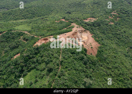 Aerial of old open cast pit on hill top belonging to small scale African gold mining company, Ghana Stock Photo