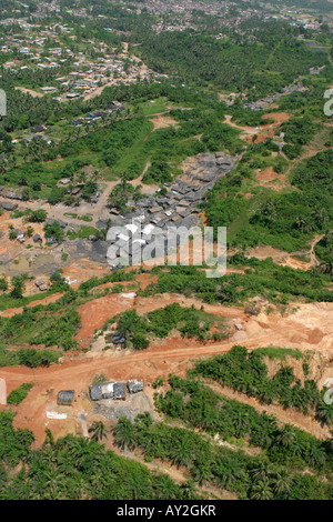 Aerial of environmental damage due illegal gold mining  from Galamsay activity, with Prestea township in distance, Ghana Stock Photo