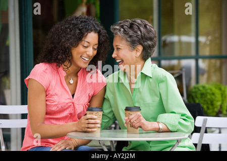 African American mother and adult daughter laughing Stock Photo