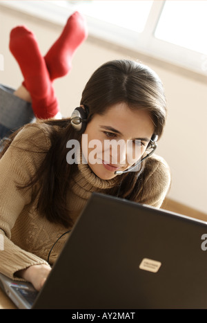 Woman Using Computer and Telephone Headset Stock Photo