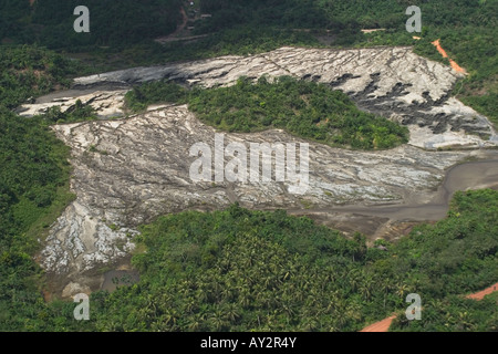 Aerial view of commercial gold mines old tailings dam with wall failure showing gully erosion and pollution, Ghana Stock Photo