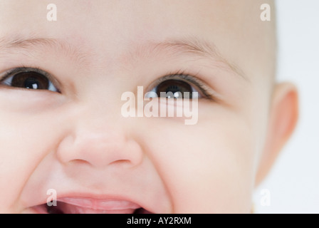 Close up of Hispanic baby smiling Stock Photo