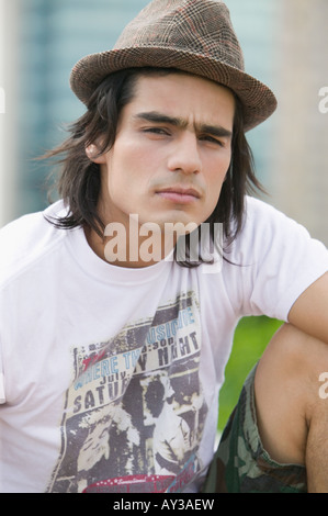 Young Hispanic man wearing hat Stock Photo