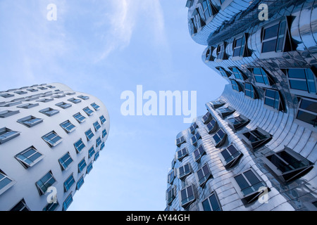 left and middle buildings of Frank O. Gehry's 'Neuer Zollhof' at Dusseldorf Media Harbour, view from the ground up Stock Photo