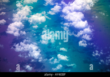 Airplane window view clouds on sea from 30 000 feet Stock Photo