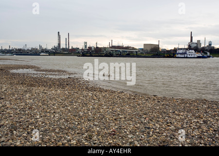 Bayer AG chemical industry plant on the banks of the river Rhine near Leverkusen, cargo ships in front Stock Photo